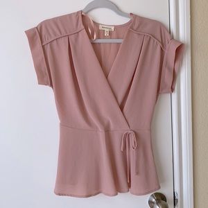 A light pink blouse.   Size is a small.    Has no damages never worn  no tags
